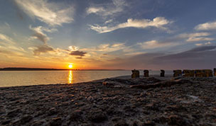 Hintergrundbild - Sonnenuntergang über der Förde
